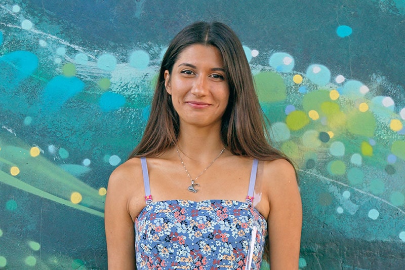 Smiling lady with a colourful background