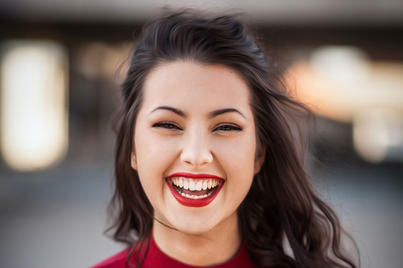 Smiling lady with windswept hair